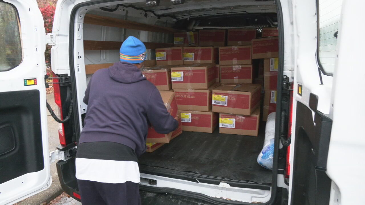 Louisville's Community Connections Group delivers frozen turkeys and chicken to community members ahead of the Thanksgiving holiday
